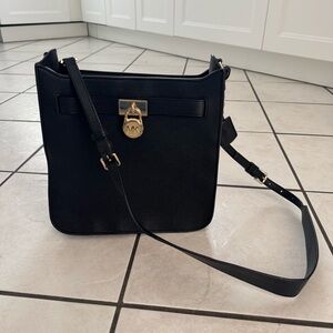 Michael Kors black cross body shoulder purse with gold lock accent, NWOT